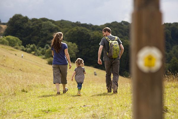 Walkers striding ahead along the Cotswold Way. Picture by Nick Turner, courtesy Cotswolds Conservation Board.